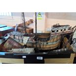 A box containing an old wooden model galleon - for restoration