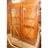 A 76cm reproduction yew wood bookcase top with shelves enclosed by a pair of astragal glazed panel