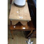 A rustic pine foot stool, set on standard ends - sold with a reproduction walnut occasional table,