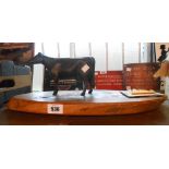 A quantity of assorted collectable items including, horse plaque, cast cow figure, etc.