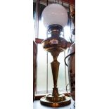 A late 19th Century cast brass oil lamp of column form with brass reservoir, later burner and