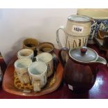 A quantity of studio pottery including mugs, dish, etc. - sold with a Denby stoneware hot water jug