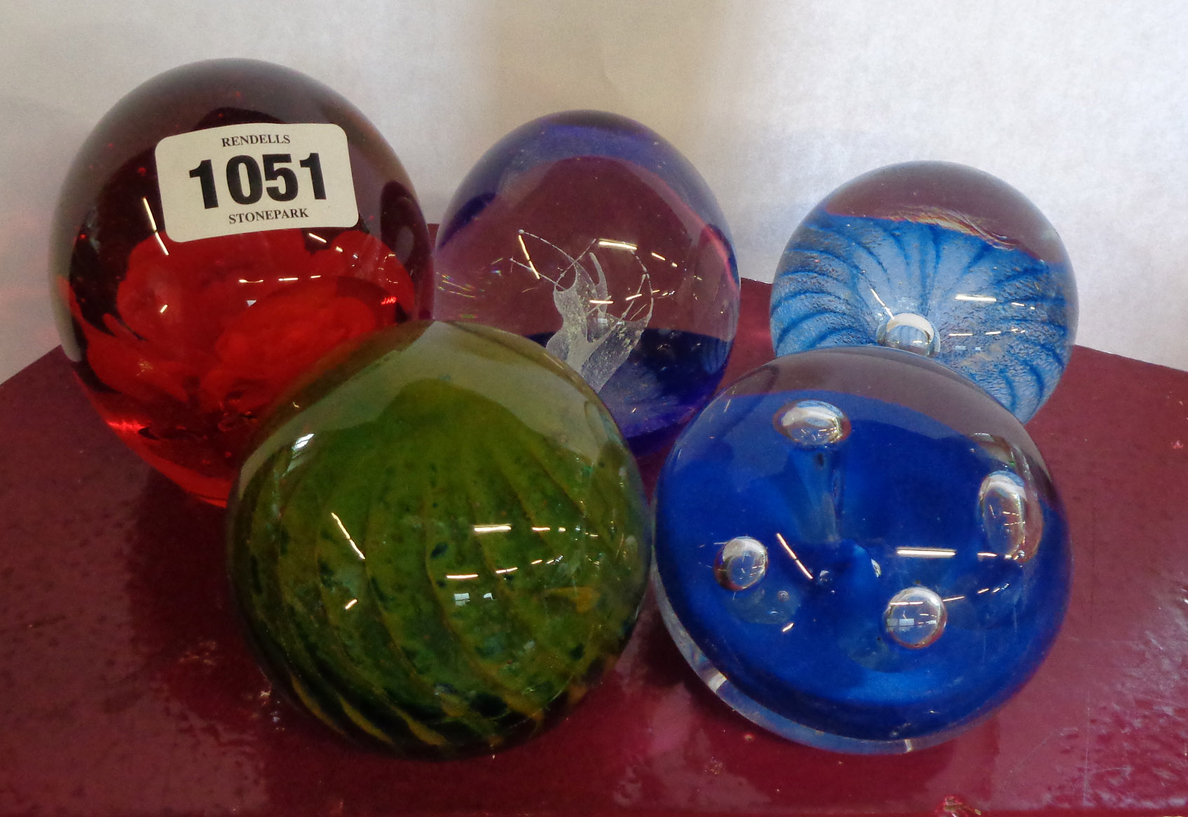 Five glass paperweights including M'dina, etc.