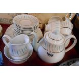 A vintage Queen Anne bone china part tea set in the Caprice pattern comprising teapot, four trios,
