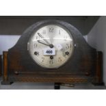 A vintage oak cased mantel clock with English eight day Westminster chiming movement
