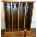 A retro teak effect four section CD rack