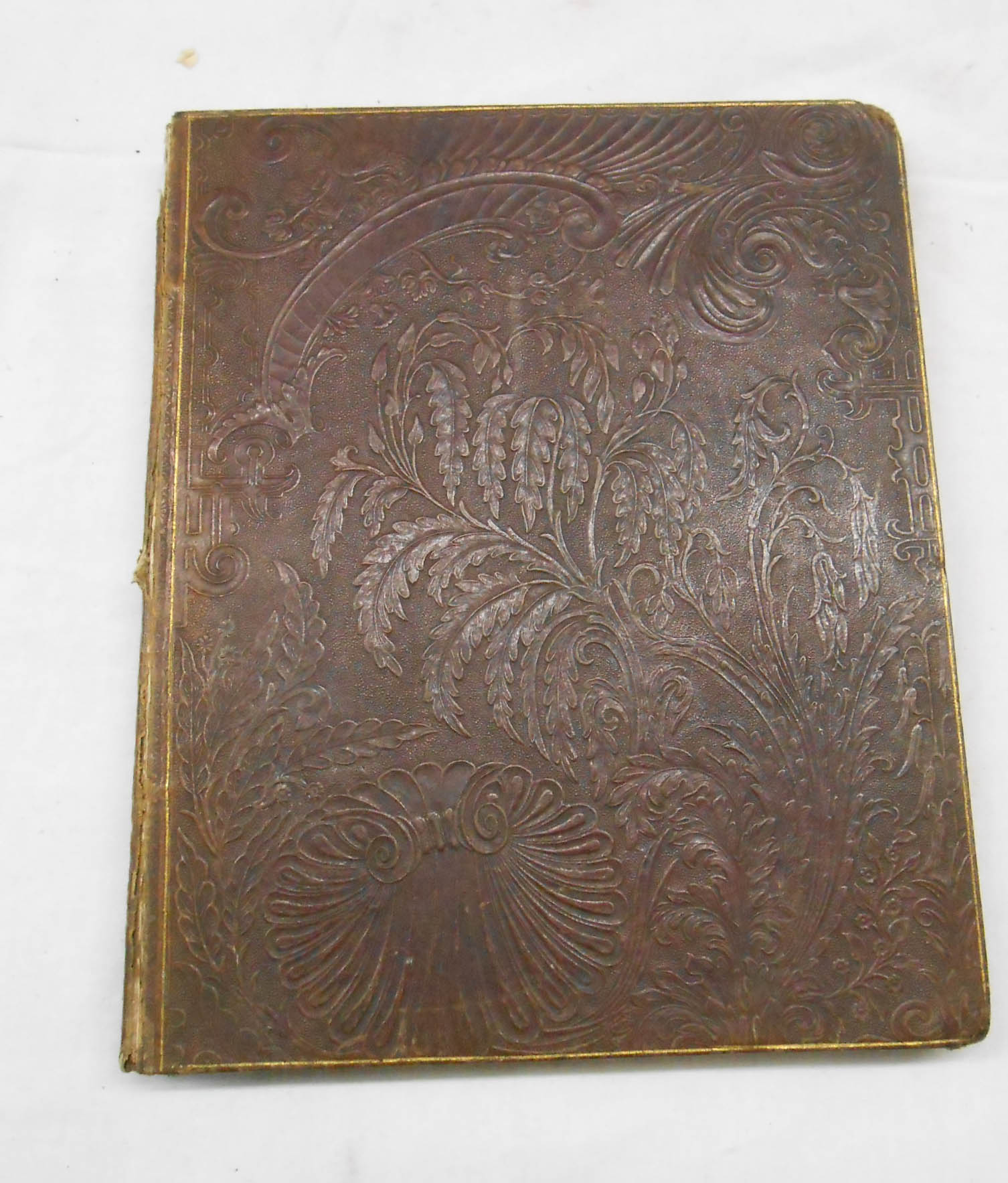 A late Victorian cookbook with extensive handwritten recipes and 4to. tooled leather binding