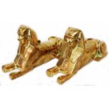 A pair of 20th Century Egyptian cast brass sphinx models