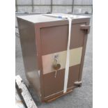 A large metal safe with key