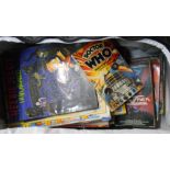 A hold-all containing a collection of assorted comics including Beano, Futurama, Simpsons and