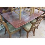 A 1.57m retro stained wood dining table with shaped top, set on moulded legs - finish worn