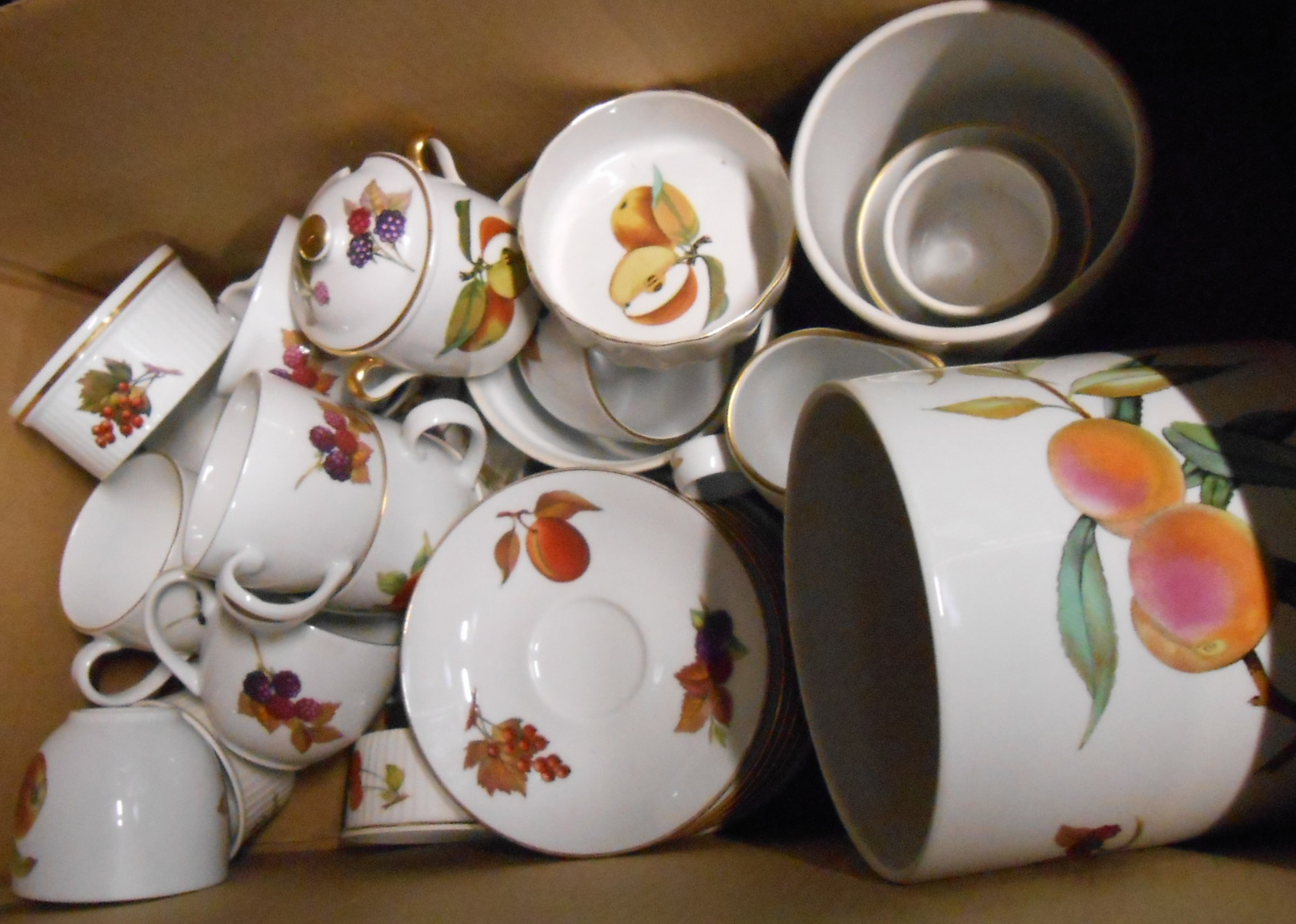 A box containing a quantity of Royal Worcester Evesham oven to table ware including cups and