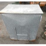 A galvanised metal coal bin