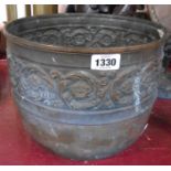 An old copper jardiniere with embossed classical frieze