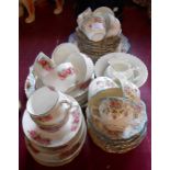A Royal Doulton bone china part tea set with transfer printed rose decoration - sold with a