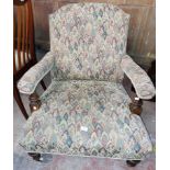 A late Victorian drawing room open armchair with later tapestry upholstery, set on turned front legs
