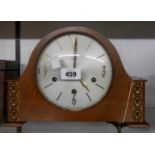 A vintage walnut cased mantel clock with Smiths floating balance eight day chiming movement