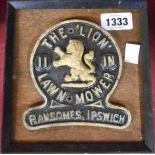 A framed and mounted cast iron maker's plaque for 'The Lion' lawnmower Ransoms, Ipswich