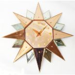 An Art Deco peach and clear mirror glass clad starburst wall timepiece with Smiths 'Sectric'