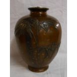 A Japanese Meiji period bronze vase of globular form with moulded bamboo decoration on a two