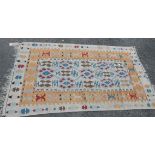 An Indian handmade Kelim, with pierced and stitched geometric designs on oatmeal ground - 1.85m x