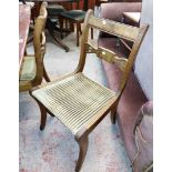 A set of six reproduction mahogany framed sabre leg dining chairs with upholstered seats