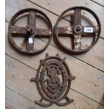 A pair of old cast iron chicken coop wheels - sold with the cast iron crest from a Singer sewing