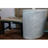 A Lloyd Loom corner laundry basket with later painted finish - sold with a tapestry upholstered