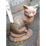 A cast iron doorstop in the form of a seated cat
