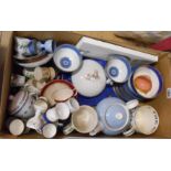 A box containing a quantity of Wedgwood and other ceramic items including teaware, commemorative