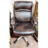 A modern SUK office swivel elbow chair upholstered in brown leatherette with height adjustment
