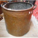 An old copper log box with two brass handles