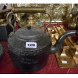 A vintage Holcroft six pint cast iron Aga kettle with brass handle and tinned metal lid with moulded