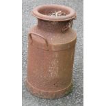 A small old cast iron milk churn - rusty