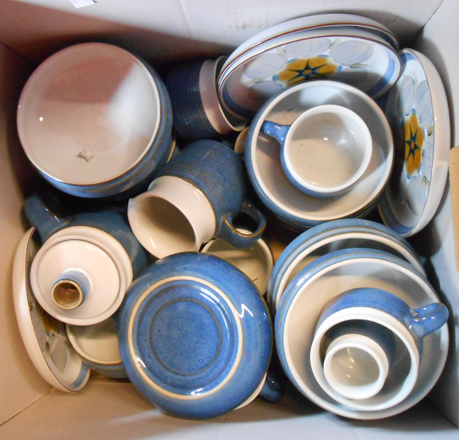 A box containing a quantity of Denby stoneware Chatsworth pattern tableware including cups and