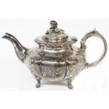A Victorian silver pumpkin pattern teapot with cast finial and engraved decoration - London, 1849