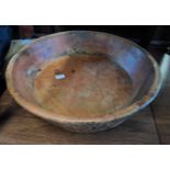 An old large carved wooden bowl