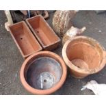 Two terracotta plant pots - sold with two oblong terracotta planters