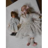 An Armand Marseille porcelain headed doll with jointed body - sold with a small Alberon doll (on