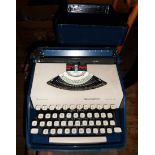 A vintage Remington Sperry Rand Envoy III portable typewriter in original hardshell carry case