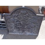 An old cast iron fire back moulded with apocryphal coat of arms for King Charles - cracked