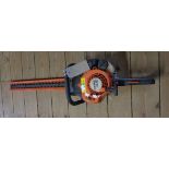 A Stihl HS45 two stroke petrol hedge trimmer with 67cm blades and original blade guard