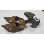 An old Black Forest carved pine bear figurine - sold with a pair of similar carved clogs