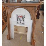 An antique bleached wood fire surround with applied hairbell decoration and arched aperture - 1.