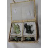 A 20th Century Chinese presentation box containing carved hardstone figurines comprising a frog, a