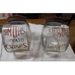 A pair of 1950's glass shop display jars advertising Smiths Potato Crisps, each with lift-off