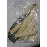 A bag containing a quantity of carved bone and ivory bookmarks, tongue depressers, plated crumb