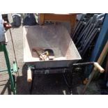 A small galvanised garden wheelbarrow with solid rubber tyre