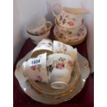 A vintage Duchess bone china part tea set comprising five trios, one large cup and saucer, milk