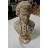 A carved alabaster bust depicting Mozart